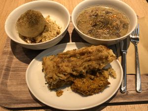 Seitan dumpling with cabbage, mushroom stew, pumpkin lasagna  at Venuss - Herrengasse in Vienna