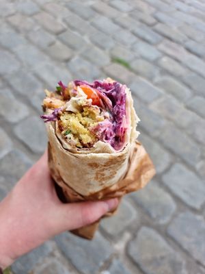 "Gudrunsvej" Falafel roll with grilled aubergine, chili-potatoes and vegan dressing. at Faour in Aarhus