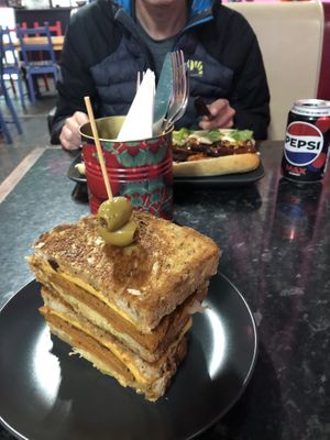 Philly cheesesteak in foreground and banh mi in the background   at Guac 'n' Roll in Liverpool