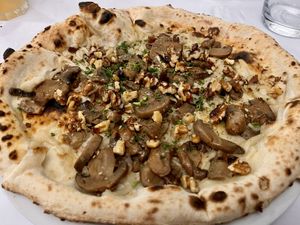 Umbria: Vegan mozzarella, mushrooms, walnuts, truffle, and parsley. Tasty and really good base; no crusts left! at Vitalia's in Cairns