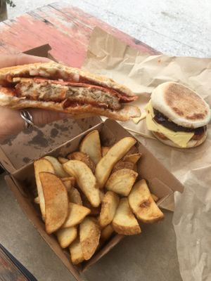 Phish or Parma burger (I am not sure), fries and breakfast muffin at Lord of the Fries in Queenstown
