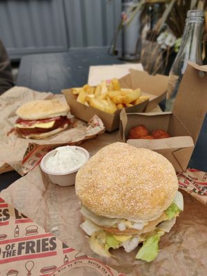 The Biggie (front) and Parma burger, fries, mac 'n cheese balls and sauce at Lord of the Fries in Queenstown