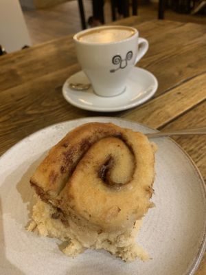 Vg cinnamon bun. It was warmed. Oat milk latte with caramel syrup  at Jaunty Goat - Bridge St in Chester