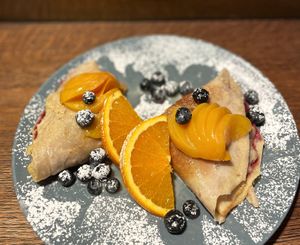 CRÊPES SUZETTE
buckwheat Crêpes with peach, vanilla cream with hints of orange & blueberries jam  at Relax na Wilczej in Warsaw
