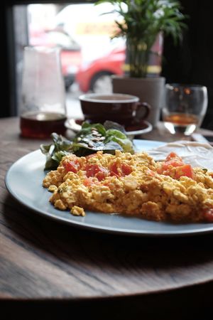The Tofu scramble with tomato, basil & shallot is our absolute favourite vegan breakfast option - we serve it with rye bread and soy mayo. at Relax na Wilczej in Warsaw