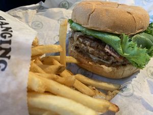 Guacamole burger and fries   at Plant Power Fast Food in Redlands