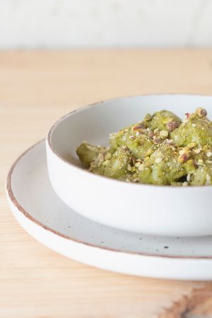 Ñoquis con pesto verde de almendras, piñones y pistachos  at Umami Good Food in Tenerife