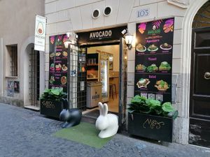 Entrance in a quiet side street at Avocado Bar in Rome