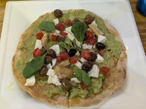 Avocado Pinza with tofu, olives, and porcini at Avocado Bar in Rome