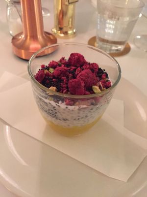 Yummie dessert 🍨 Chia pudding with shock frosted raspberries, nuts, sesame seed and mango purée  at Bills in Fukuoka