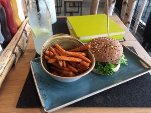 burger with sweet potato fries at Hans im Glück in Muri Bei Bern