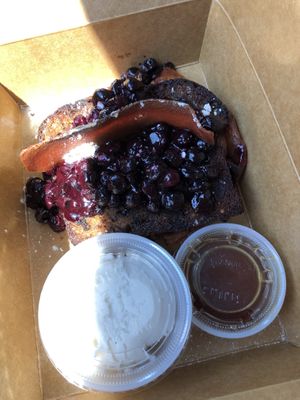 Loaded French toast!! It’s two pieces of French toast with caramelized apples in between, topped with blueberries and a piece of vegan bacon, also, coconut-based vanilla ice crea at Alternative Plate in Lake Como