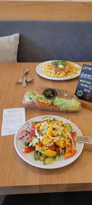 300gr of mixed salads and a smoked tofu baguette. Vegetarian pasta wt sundried tomato sauce on the back at Slunecnice in Plzen