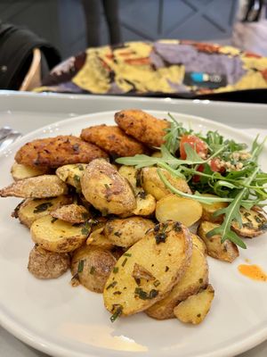 Roastes potatoes and a little salad on the side.  at Slunecnice in Plzen