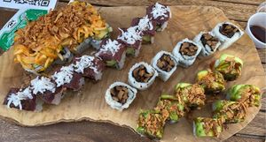 Top roll is amazing Zuchinni that taste like spicy crab, then harvest roll, mushroom roll,  and an amazing eggplant filled rolls topped with Avo and crunch  at Tomo Sushi & Ramen in Philadelphia