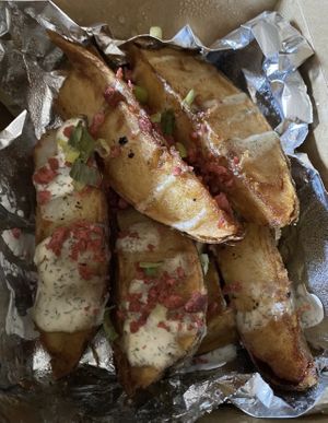Potato wedges with garlic aioli   at The Happy Bakery in Ofallon