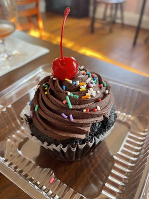 Queen Crème-filled Ghirardelli’s Chocolate cupcake   at The Happy Bakery in Ofallon