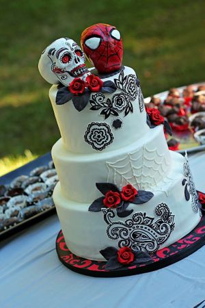 Whimsical Spiderman and Sugar Skull themed wedding cake at The Happy Bakery in Ofallon