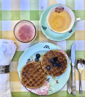 Waffles with raw honey, strawberry smoothie & green tea at The Bel Air Treehouse in Los Angeles