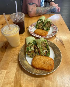 “BREKKIE BURRITOS” w/ side of hash browns & “DREAMSICLE” smoothie & “COLD BREW COFFEE"  at Culture Coffee & Tea Bar in Virginia Beach