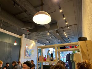 Indoor seating area, art, and items for sale at LB Kitchen in Portland