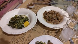 Horta salad and local capers in onion sauce. Plus complimentary melitzanosalata dip. at To Spitiko in Santorini