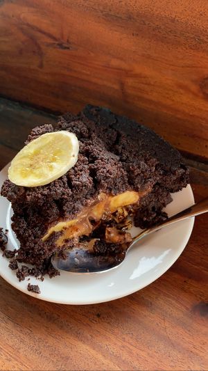 Vegan chocolate cake filled with almonds and cream and banana  at Hangten Rooftop Restaurant in Weligama