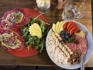 Beetroot hummus avacado toast and raspberry oatmeal bowl   at Panenská Kaviareň in Bratislava