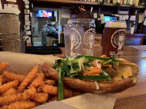 Vietnam sandwich with sweet potato fries on a vegan pretzel  at Wurst Bier Hall in Fargo
