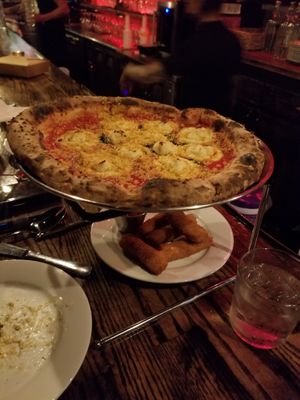 Margarita pizza and mozzarella sticks at Pura Vita in West Hollywood