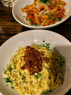 Carbonara & daily special: tomato sausage penne.  at Pura Vita in West Hollywood