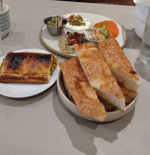 Vegan sausage roll plus 3 dips with bread delicious but would be more economical to buy individual dips with bread separately at Medina in Aberystwyth