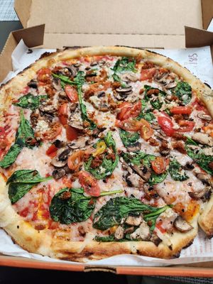 with V chorizo, mushrooms, cherry tomatoes, spinach, oregano at Blaze Pizza in Riverside