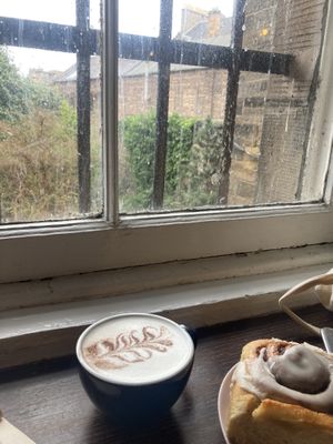 oat milk chai latte & vegan cinnamon bun  at Lovecrumbs - West Port in Edinburgh