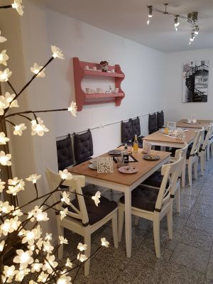 You don't really notice that the cafe is right next to the train station because the sitting area is in the back part of the cafe. at Café Loyal in Siegburg