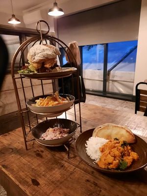 Two of the three vegan mains choices: The Scarecrow burger Aand Indian Butter Cauliflower at The Hurt Arms in Belper