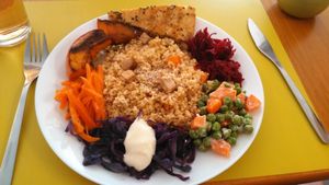 Roasted pumpkin,  shredded veggies w/vegan mayo, bulgur and smoked tofu and a salted pie at Semente Centro Macrobiótico de Braga in Braga