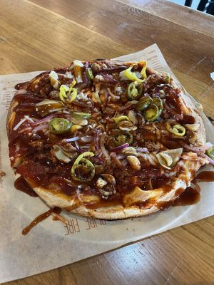 Build your own pizza. Drizzle with some bbq saucee  at Blaze Pizza in Burlington