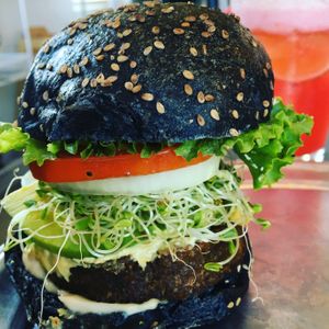 Classic Vibe Burger on Charcoal Sourdough Bun at Vibe in Hilo