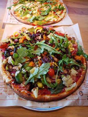 Vegan build your own in foreground. Hubby's meat pie in background. at Blaze Pizza in Amherst