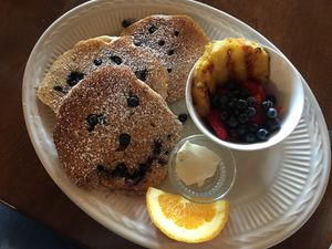 Smiling blueberry pancakes grilled pineapple  at The Causeway in Spruce Head