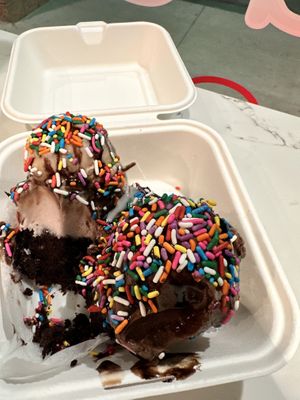 Brownie sundae with chocolate drizzle and rainbow sprinkles (taro and chocolate ice cream)  at Hug Life in Orange