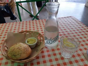 Bread, spicy vegan mayo and fizzy water at La Verduleria in Tenerife