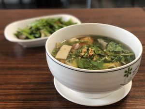 Sweet and sour soup, water spinach in background  at Xīn Huā SùShí Guǎn 心花素食館 in Hengchun