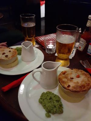 Jackfruit "steak" pie with mash gravy and mushy peas at The Barley Mow in London
