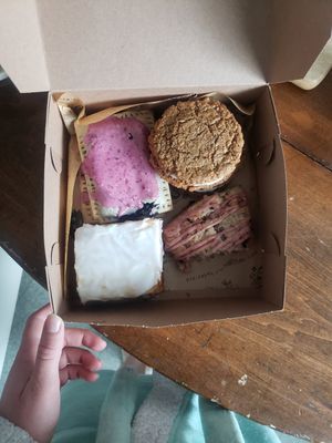 cinnamon bun, blueberry poptarts, oatmeal creme pies, berry scone. delicious! at Rise Authentic Baking Co in Grand Rapids