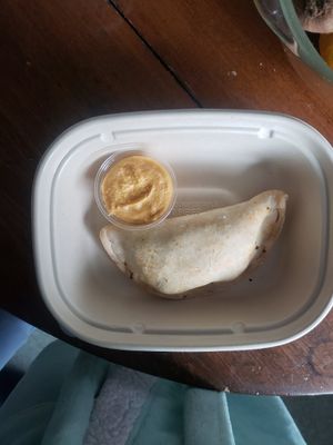 empanada with dip at Rise Authentic Baking Co in Grand Rapids