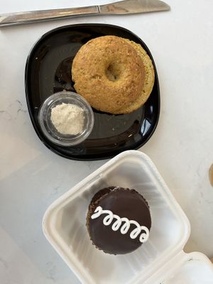 Mostess cupcake (bottom), garlic and cheese bagel with cashew cream cheese (top)   at Rise Authentic Baking Co in Grand Rapids