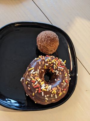 Chocolate glazed and pumpkin donut hole at Rise Authentic Baking Co in Grand Rapids