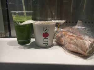 Vegetable juice, veg soup, and a baguette from a nearby stall to make a full meal at Vegeteria Juice - Shinjuku Station in Tokyo